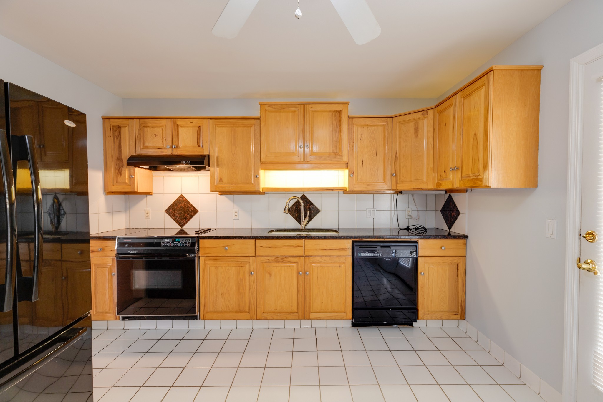 508 Ridgemont Drive Dickson, TN 37055 - Photo 16 of 44 a kitchen with stainless steel appliances granite countertop a stove a sink and a refrigerator