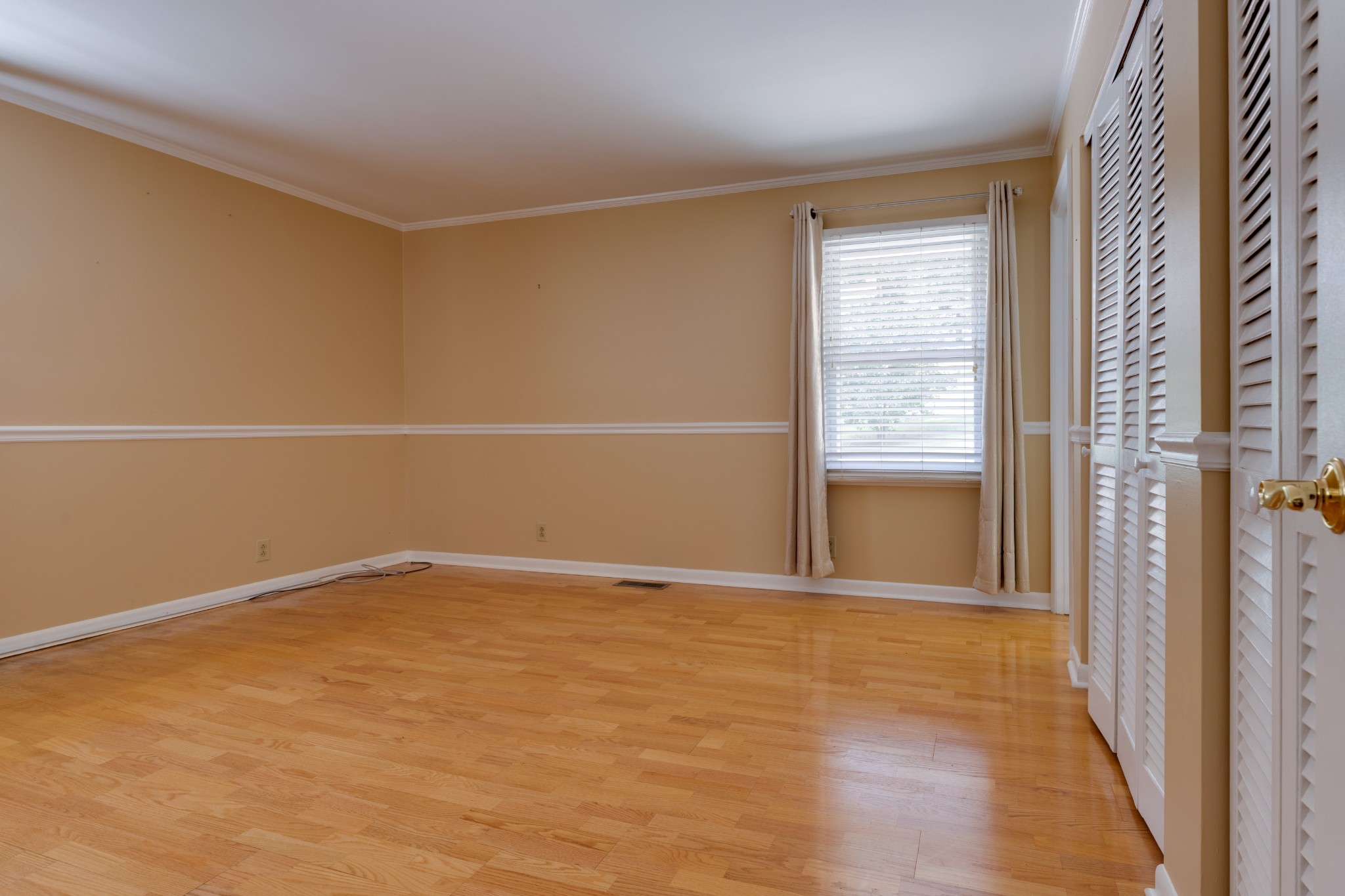508 Ridgemont Drive Dickson, TN 37055 - Photo 27 of 44 a view of an empty room with wooden floor and a window