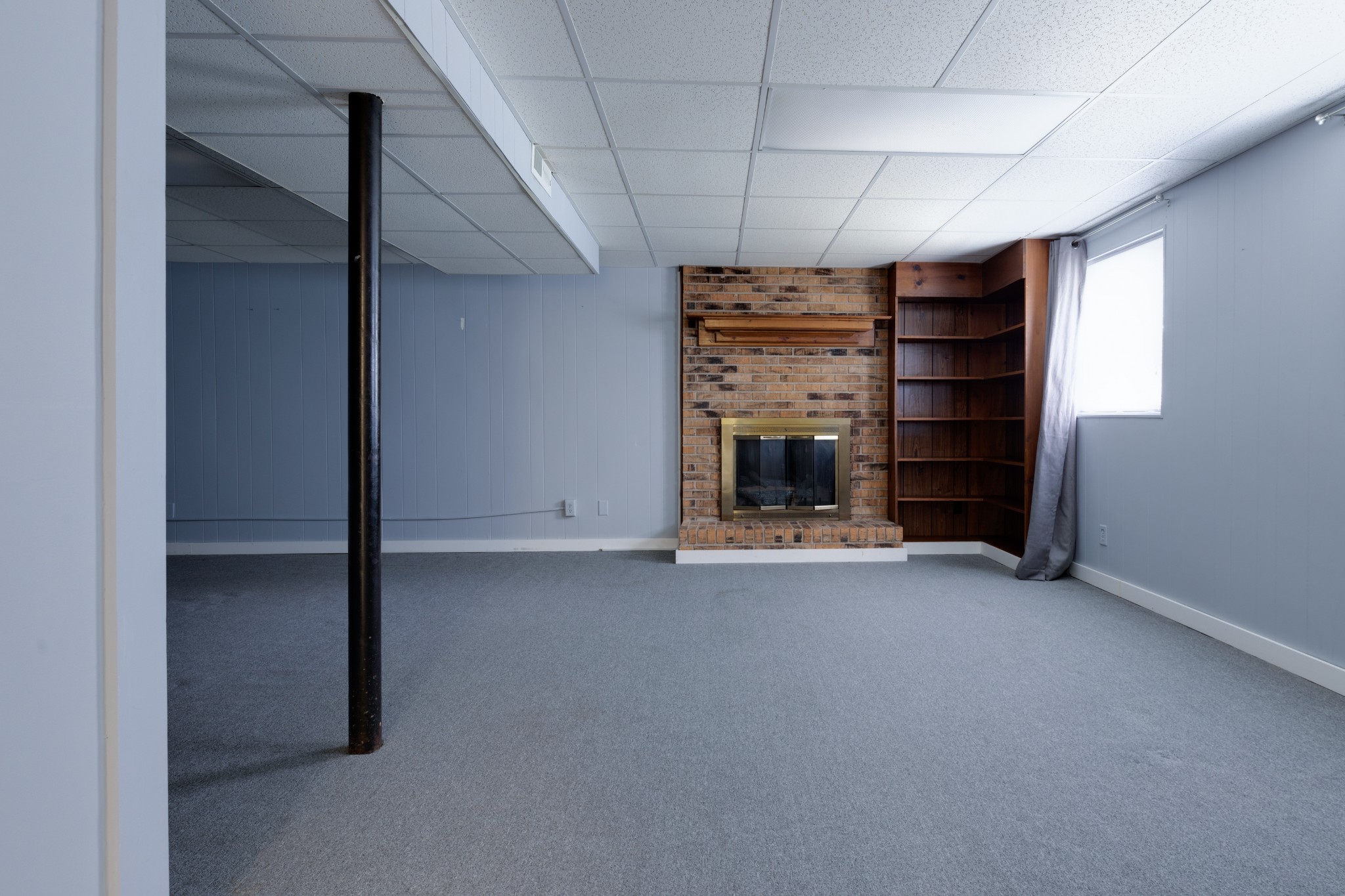 508 Ridgemont Drive Dickson, TN 37055 - Photo 35 of 44 an empty room with fireplace and window