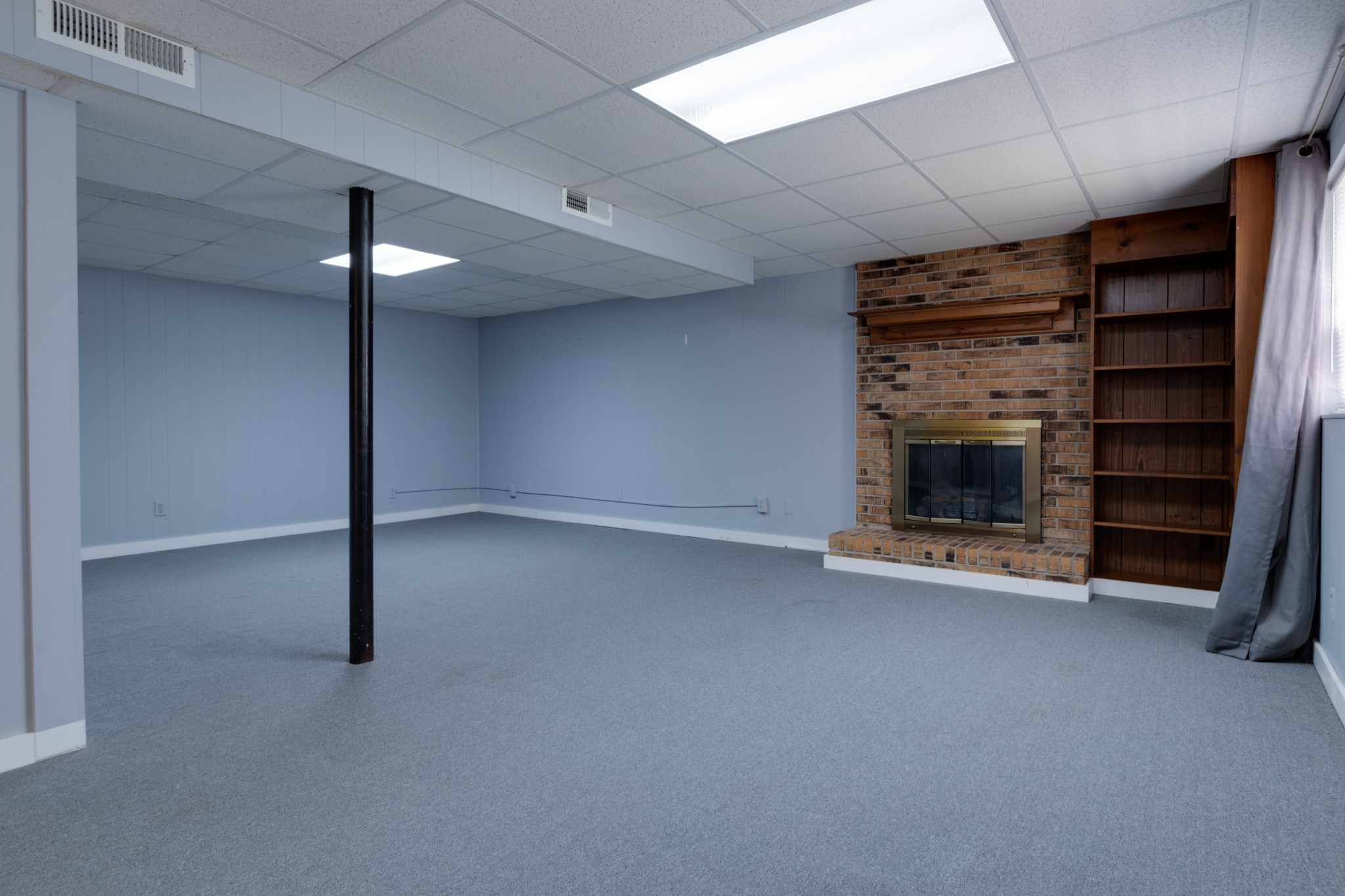 508 Ridgemont Drive Dickson, TN 37055 - Photo 36 of 44 an empty room with fireplace and window