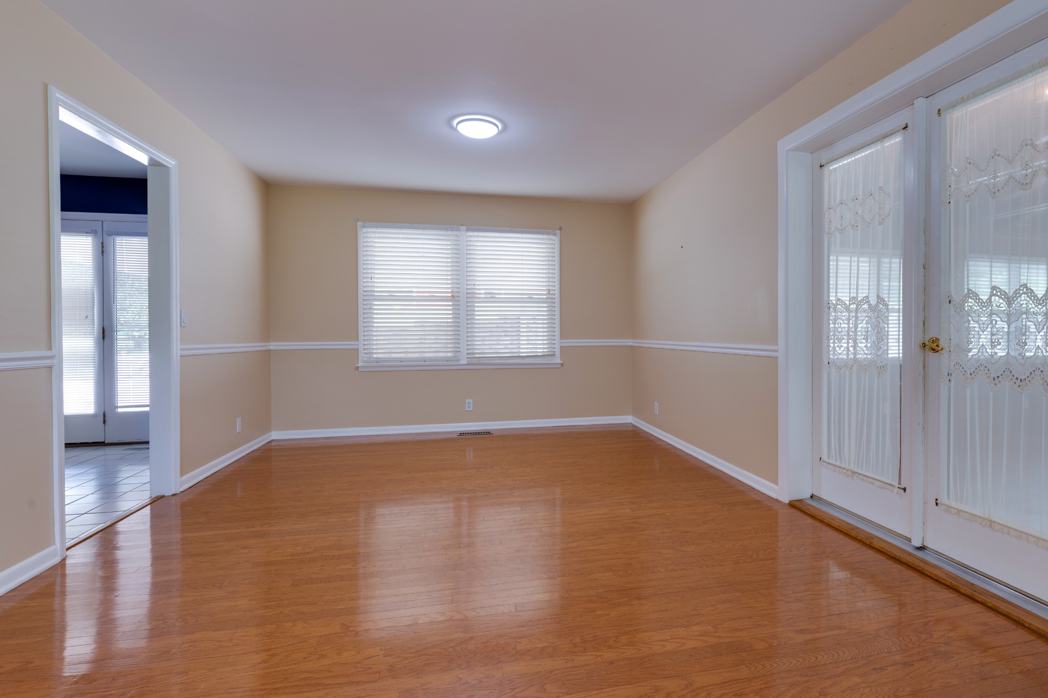 508 Ridgemont Drive Dickson, TN 37055 - Photo 9 of 44 wooden floor in an empty room with a window