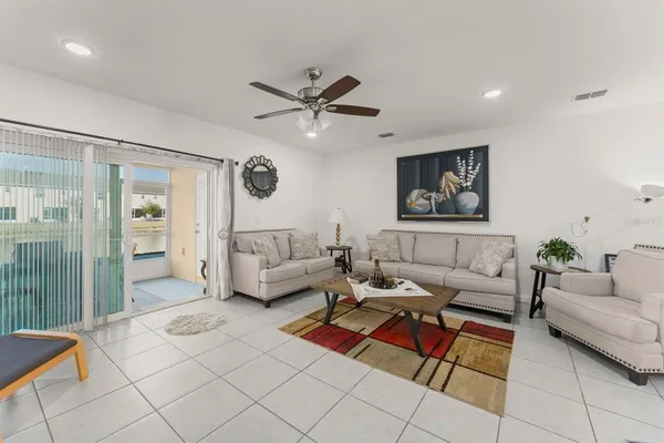 a living room with furniture and a rug