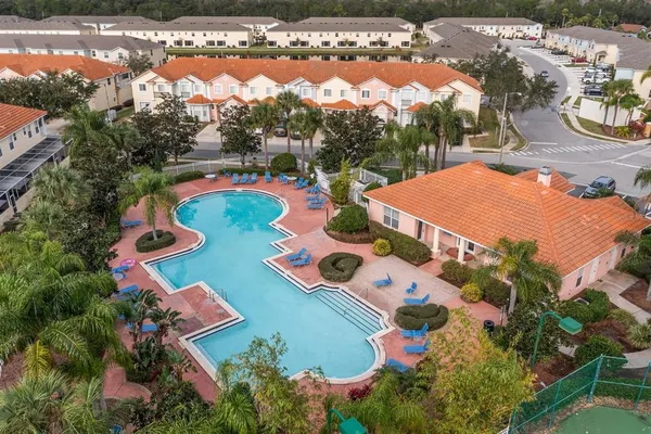 an aerial view of residential houses with outdoor space