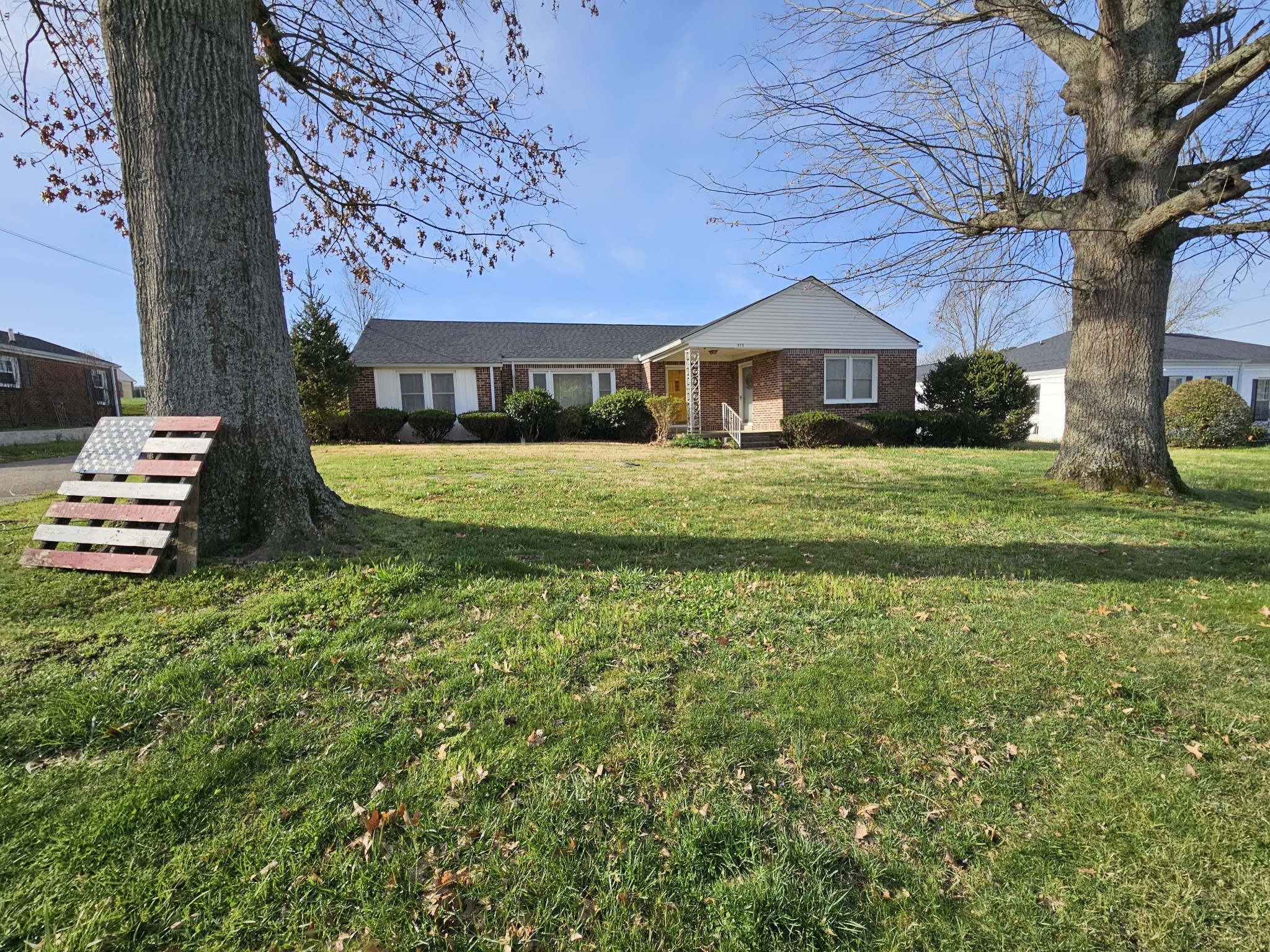 612 Jackson Avenue Carthage, TN 37030 - Photo 1 of 64 a front view of a house with a yard