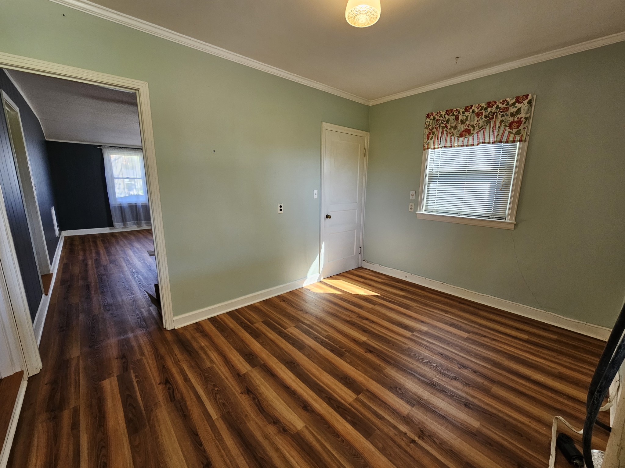 612 Jackson Avenue Carthage, TN 37030 - Photo 25 of 65 a view of an empty room with wooden floor and a window
