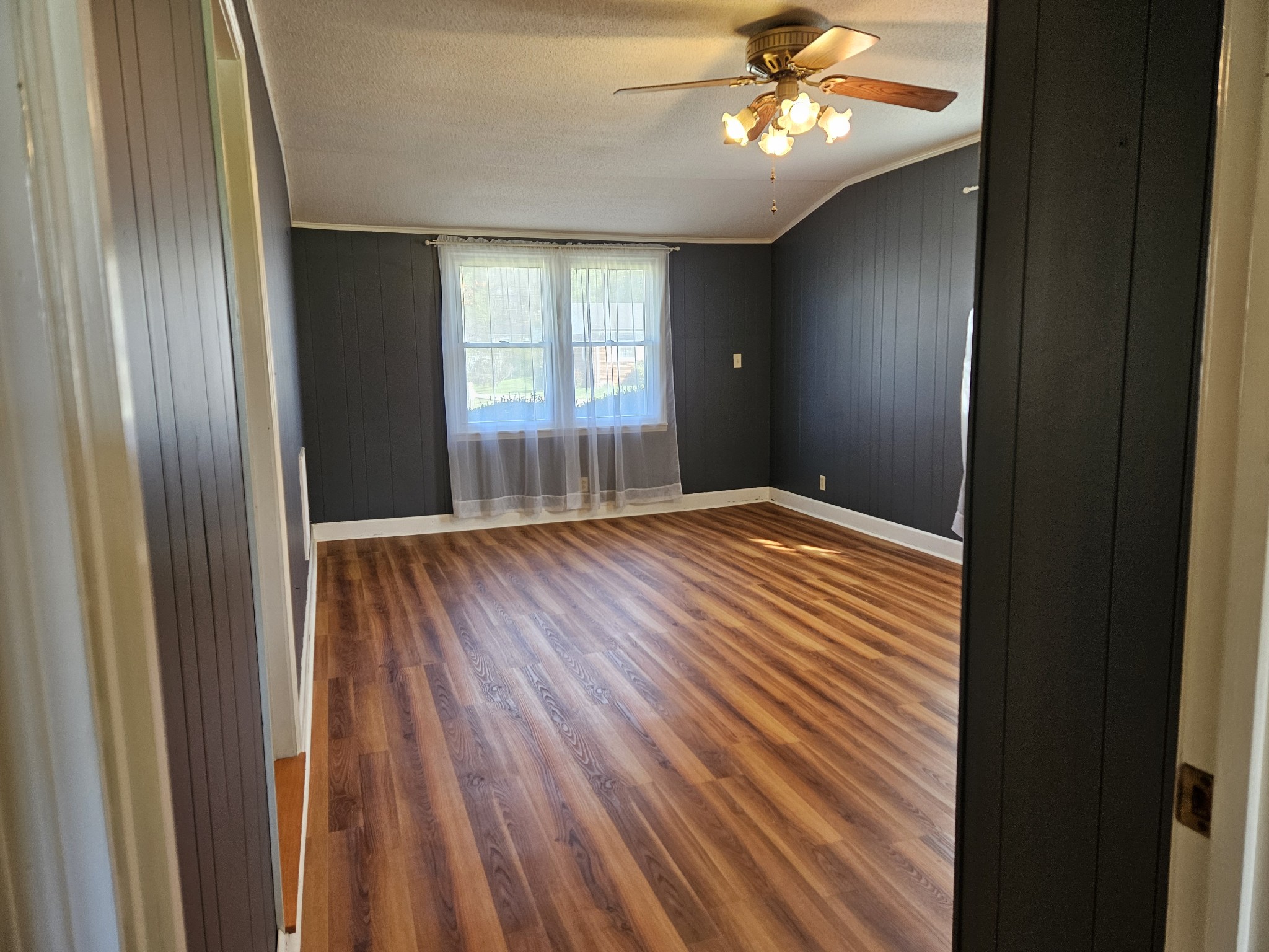 612 Jackson Avenue Carthage, TN 37030 - Photo 27 of 64 a view of an empty room with wooden floor and a window
