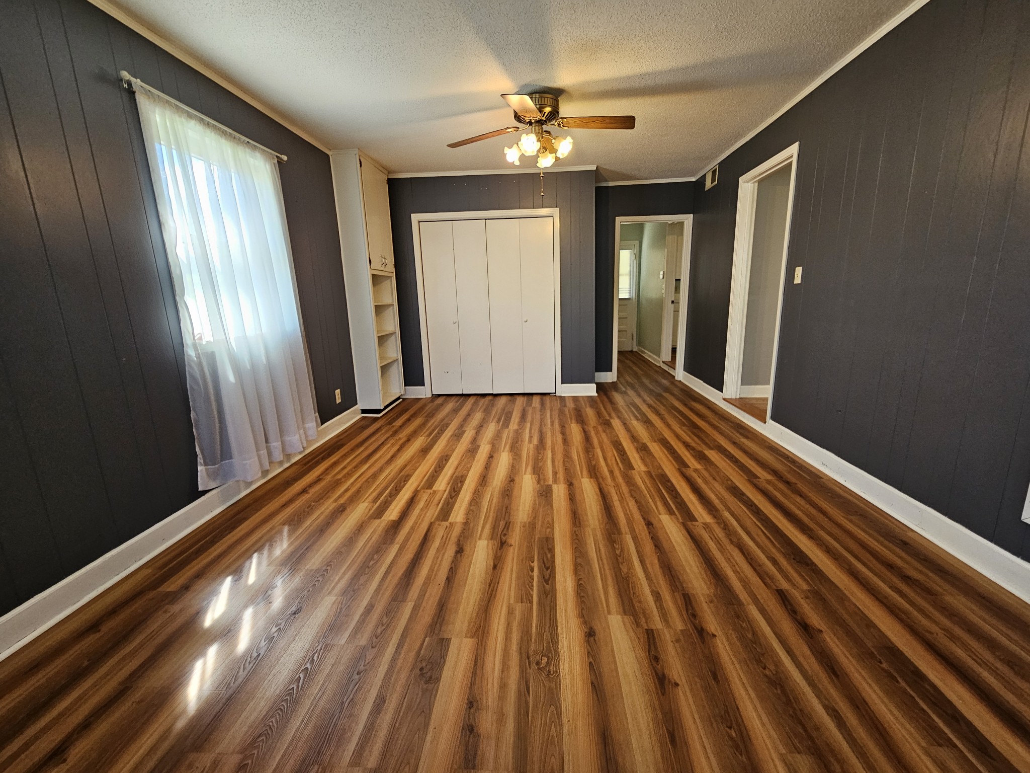 612 Jackson Avenue Carthage, TN 37030 - Photo 32 of 65 a view of empty room with wooden floor and fan