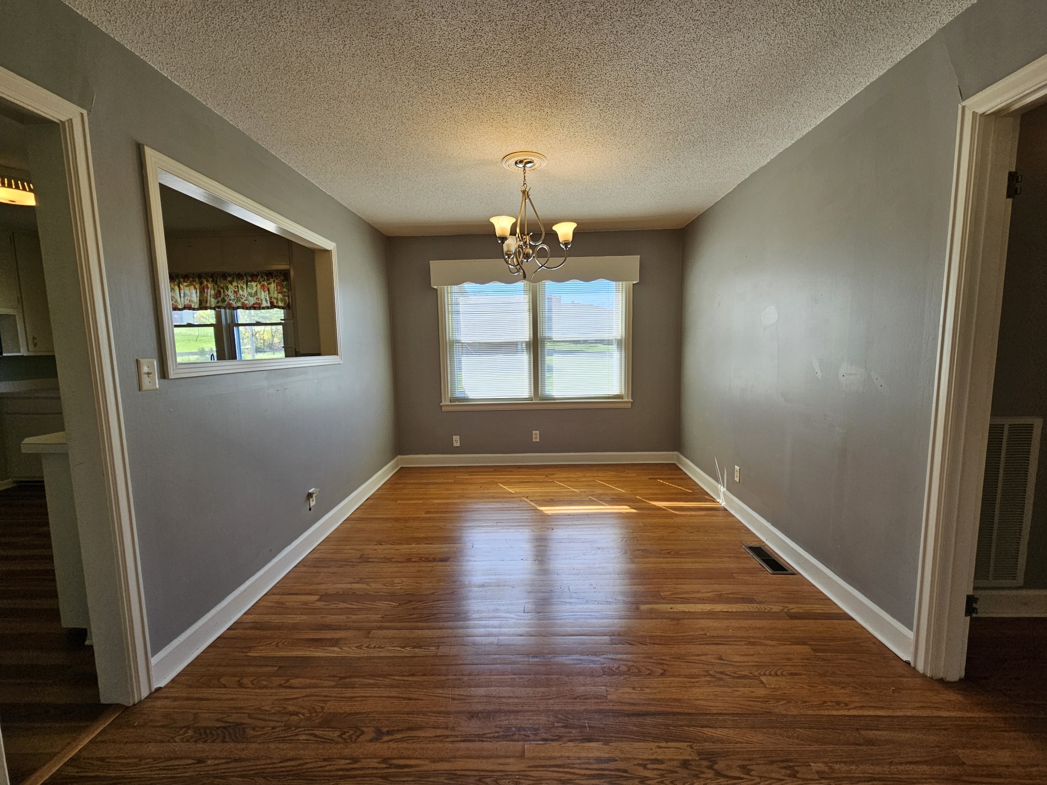 612 Jackson Avenue Carthage, TN 37030 - Photo 36 of 65 an empty room with wooden floor and windows