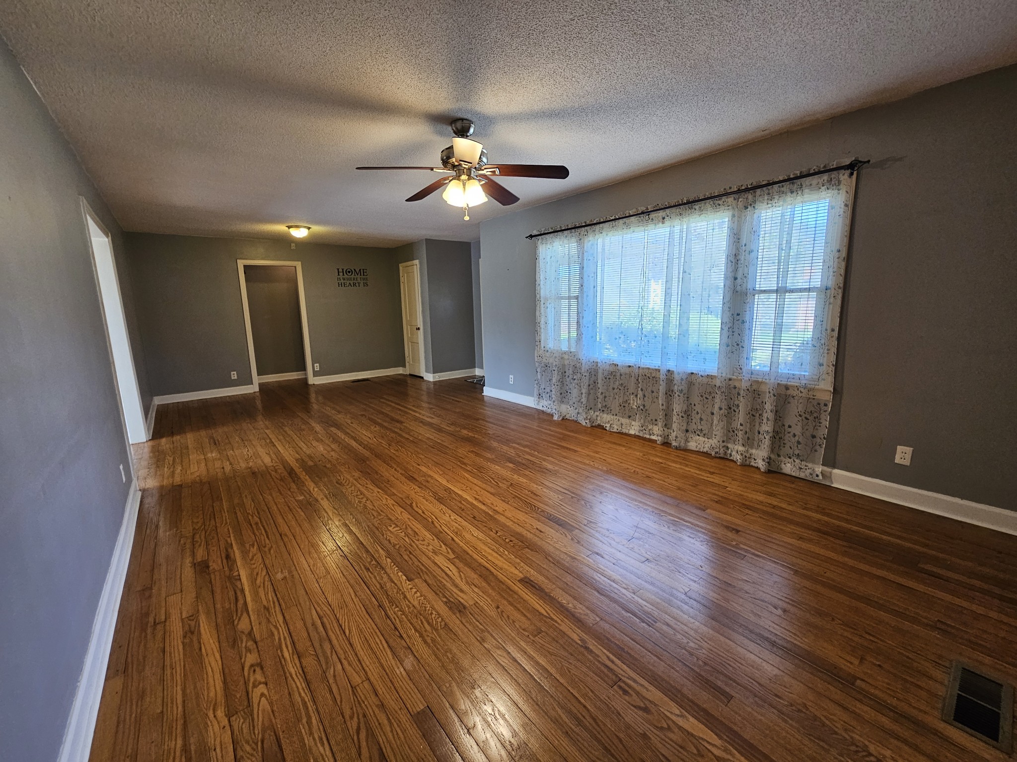 612 Jackson Avenue Carthage, TN 37030 - Photo 38 of 64 a view of an empty room with wooden floor and a window