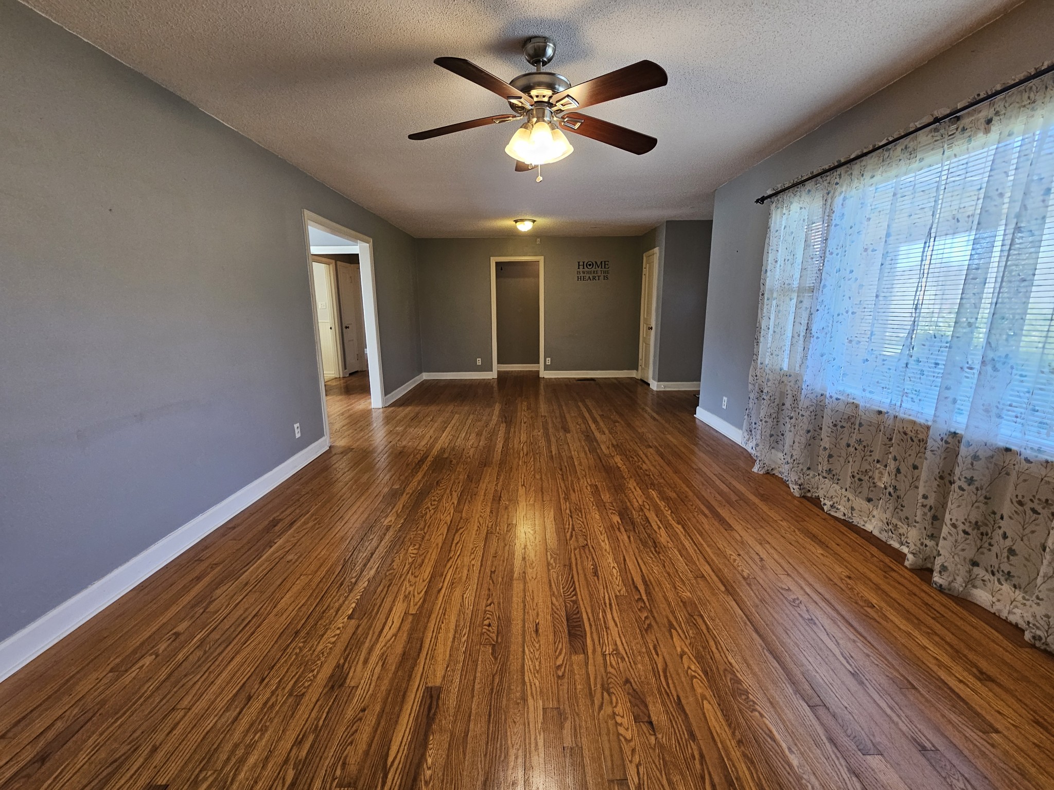 612 Jackson Avenue Carthage, TN 37030 - Photo 40 of 65 a view of an empty room with wooden floor and a window