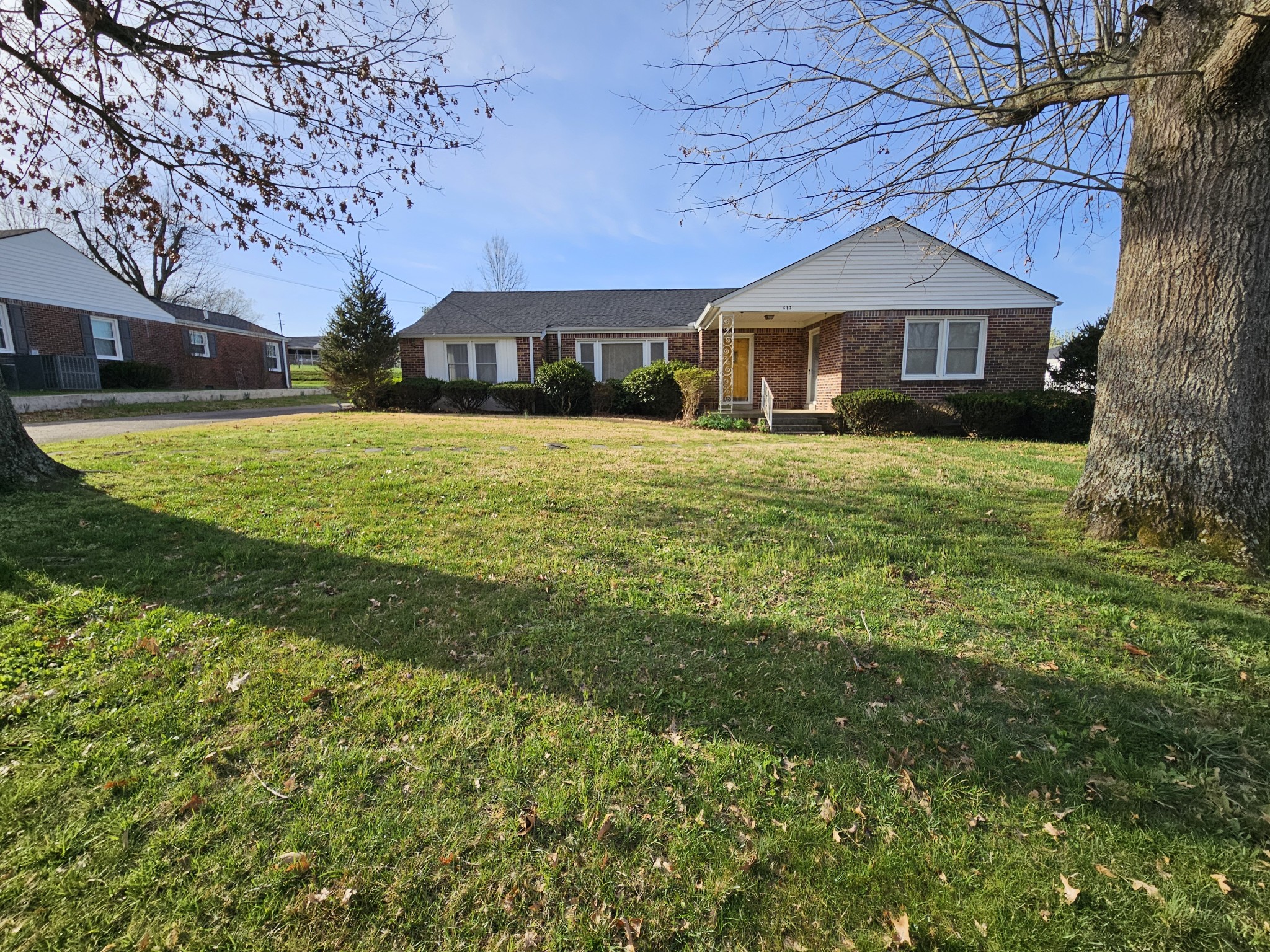 612 Jackson Avenue Carthage, TN 37030 - Photo 4 of 64 a front view of a house with a yard
