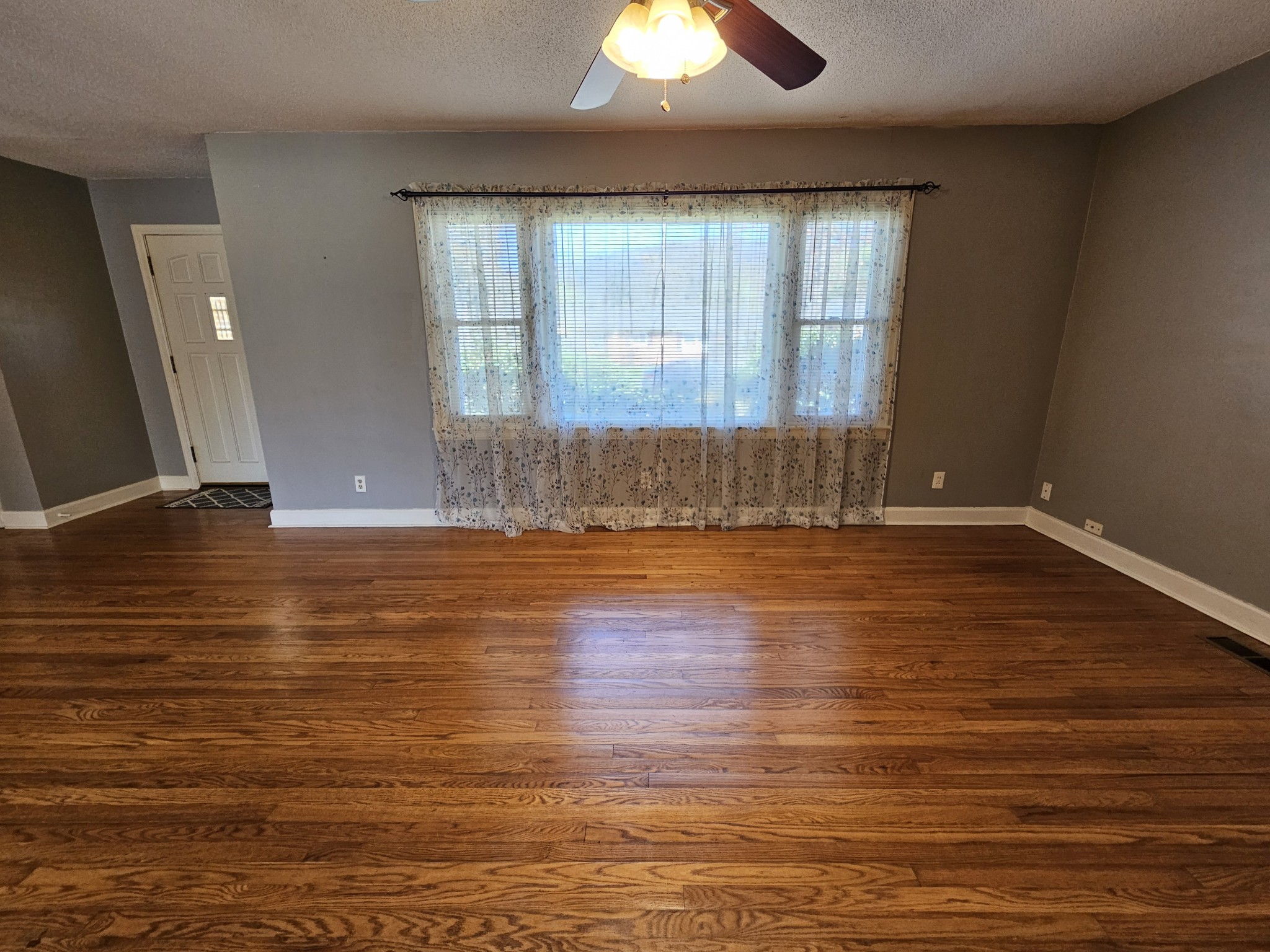 612 Jackson Avenue Carthage, TN 37030 - Photo 41 of 65 an empty room with wooden floor and windows
