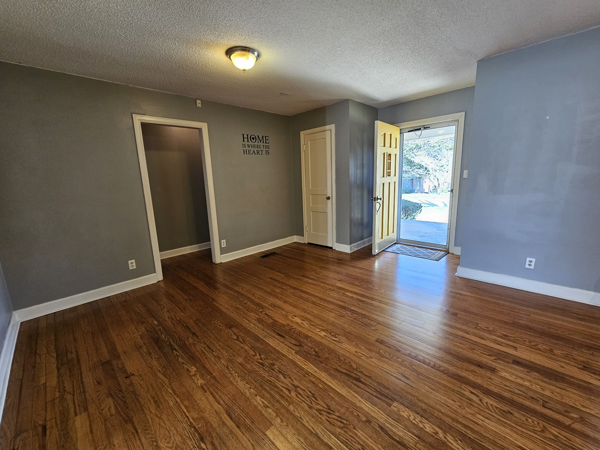 612 Jackson Avenue Carthage, TN 37030 - Photo 45 of 65 an empty room with wooden floor and windows