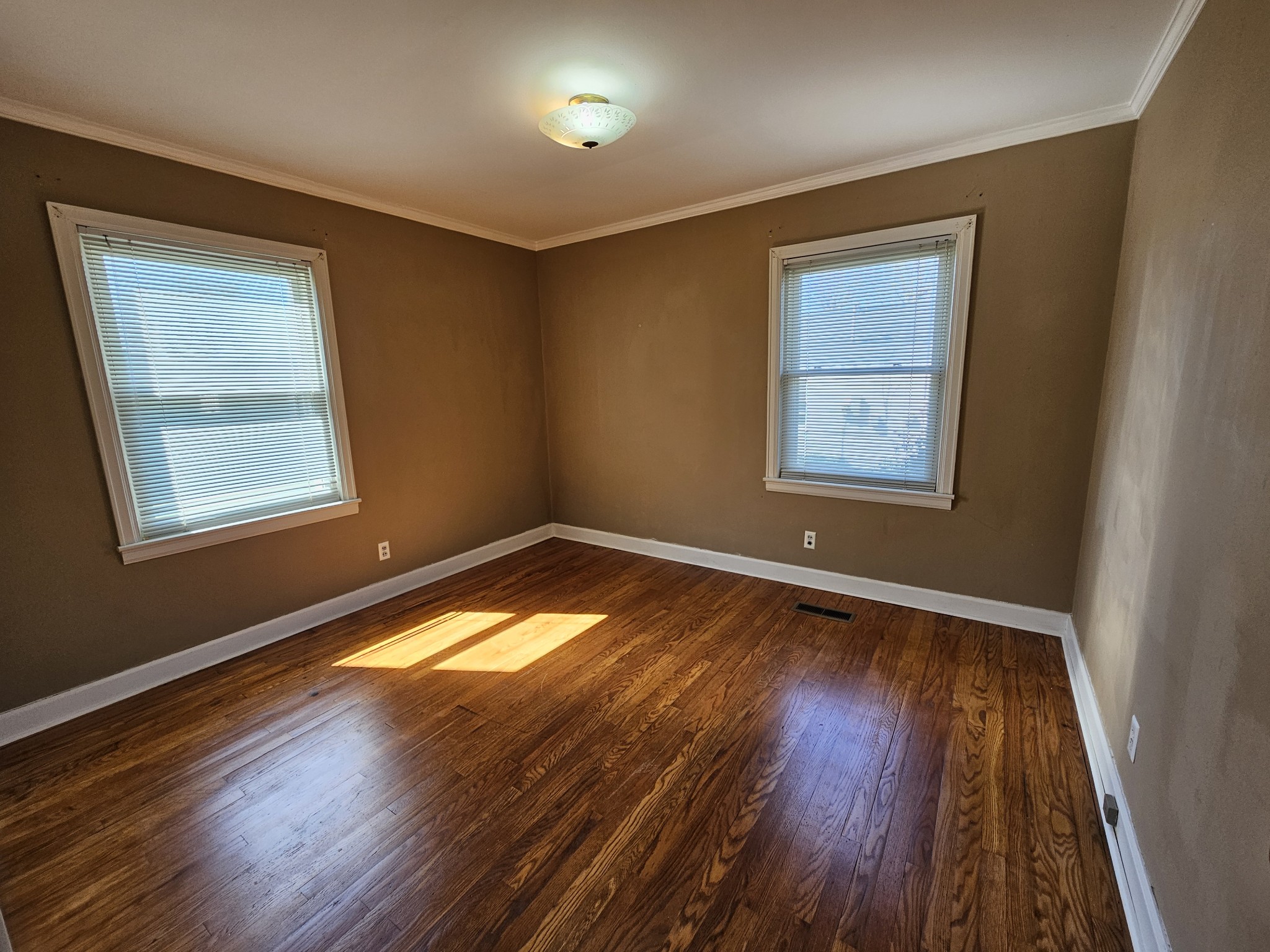 612 Jackson Avenue Carthage, TN 37030 - Photo 49 of 64 an empty room with wooden floor and windows