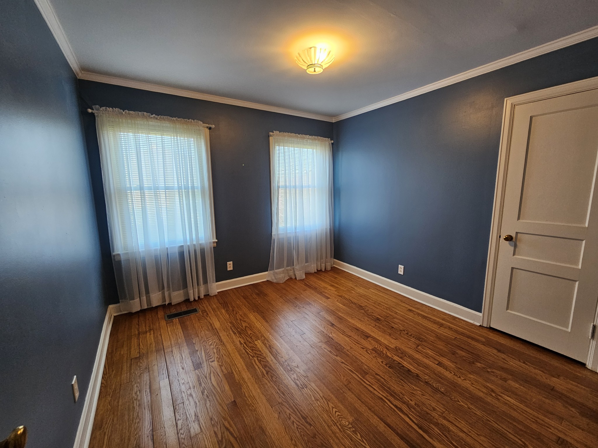 612 Jackson Avenue Carthage, TN 37030 - Photo 53 of 64 an empty room with wooden floor and windows