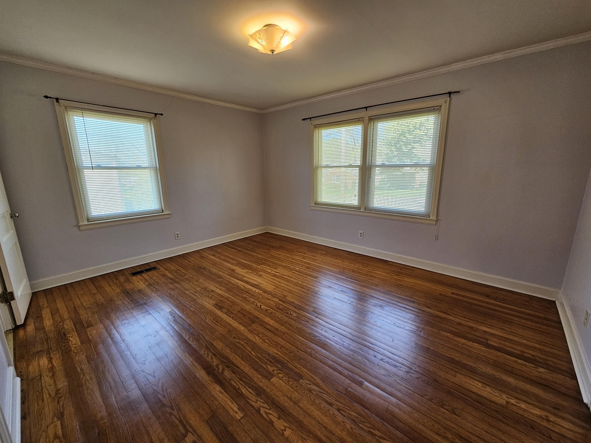 612 Jackson Avenue Carthage, TN 37030 - Photo 57 of 65 a view of an empty room with wooden floor and a window