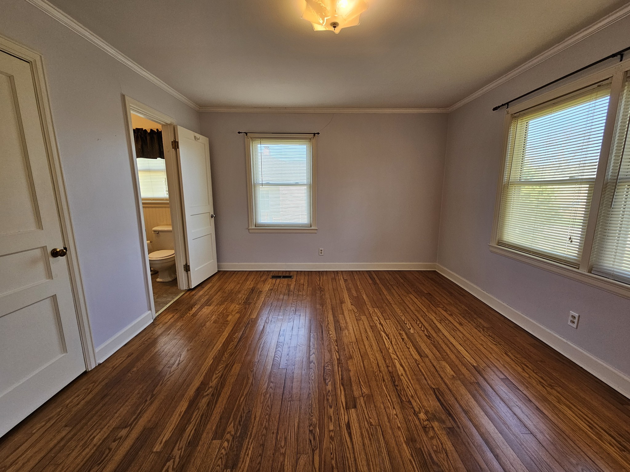 612 Jackson Avenue Carthage, TN 37030 - Photo 58 of 65 an empty room with wooden floor and windows