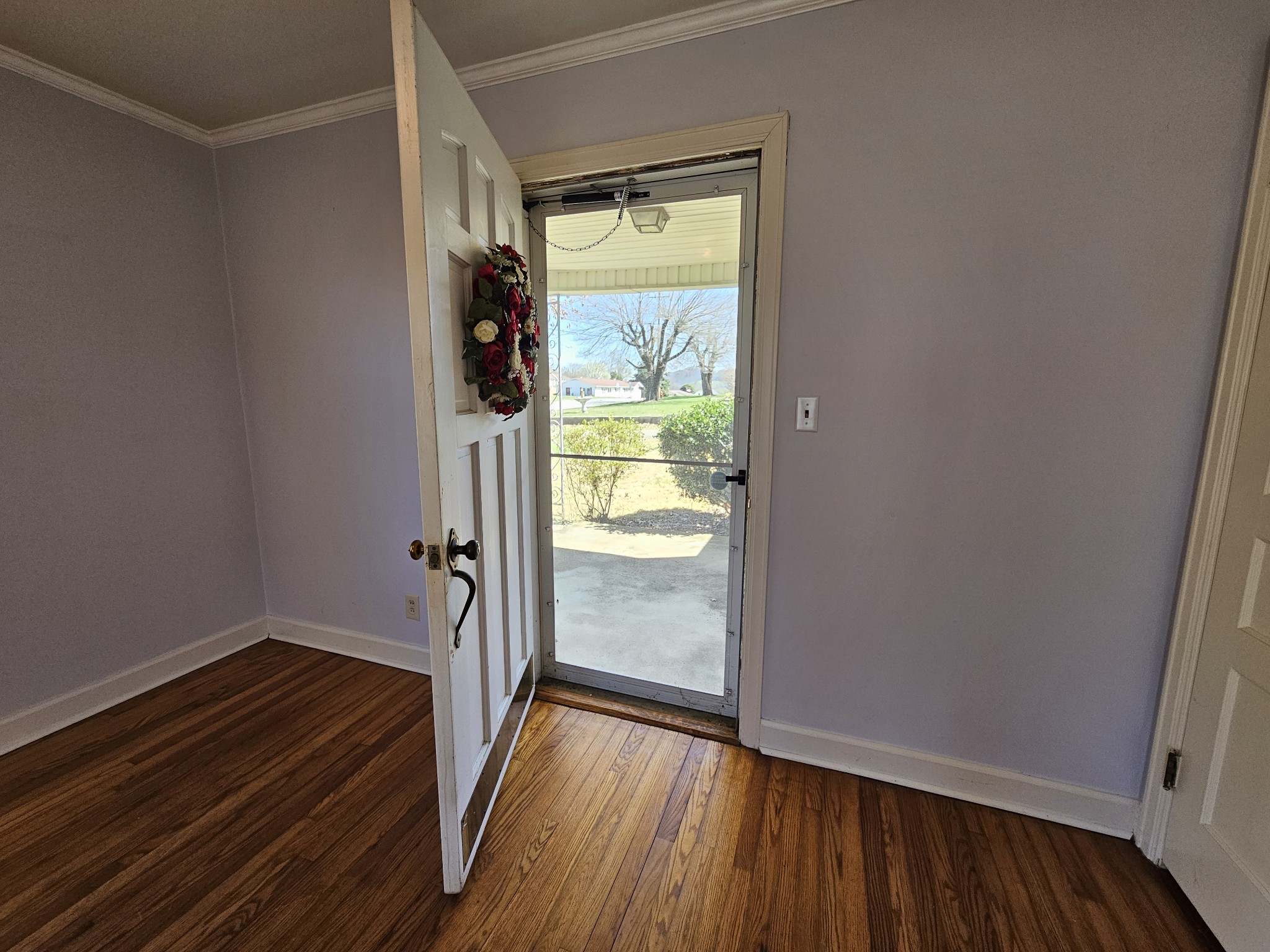 612 Jackson Avenue Carthage, TN 37030 - Photo 61 of 65 a view of an empty room with wooden floor and a window