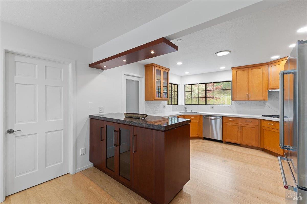 668 Wild Oak Drive Santa Rosa, CA 95409 - Photo 23 of 46 a kitchen with stainless steel appliances granite countertop a stove a sink and a refrigerator