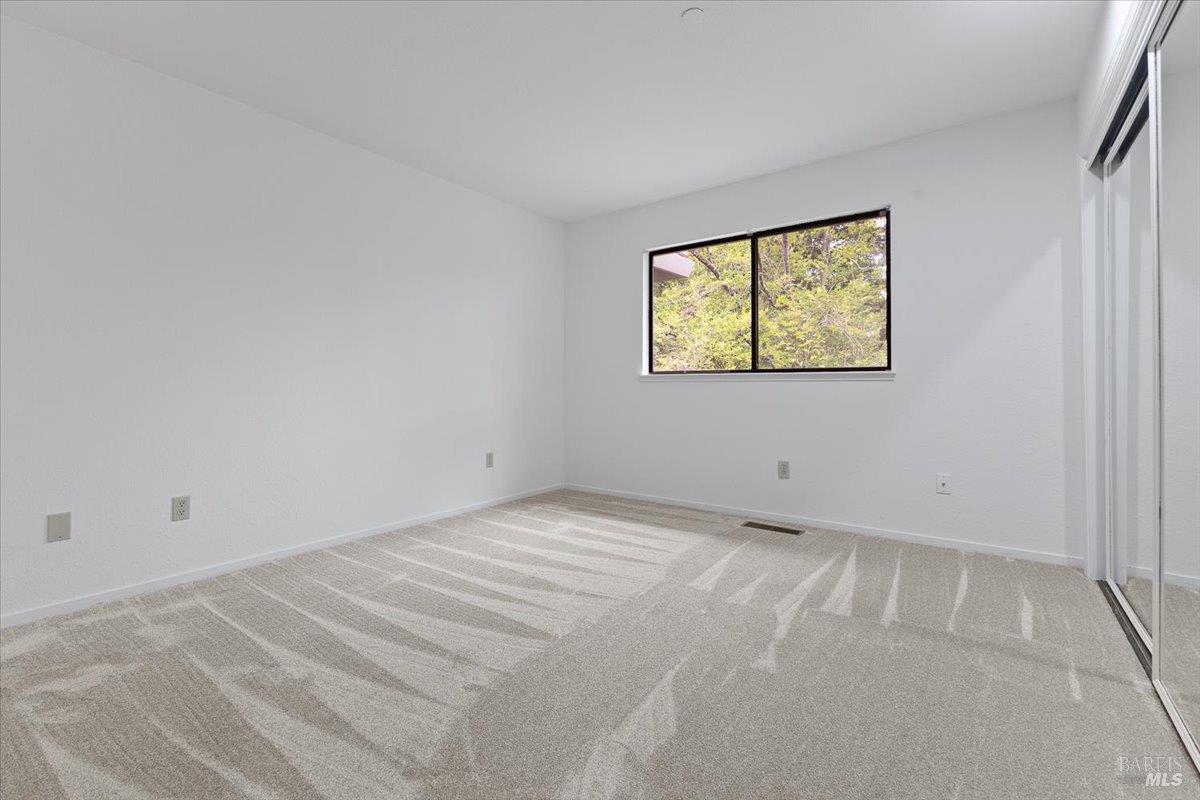 668 Wild Oak Drive Santa Rosa, CA 95409 - Photo 24 of 46 a view of an empty room with a window