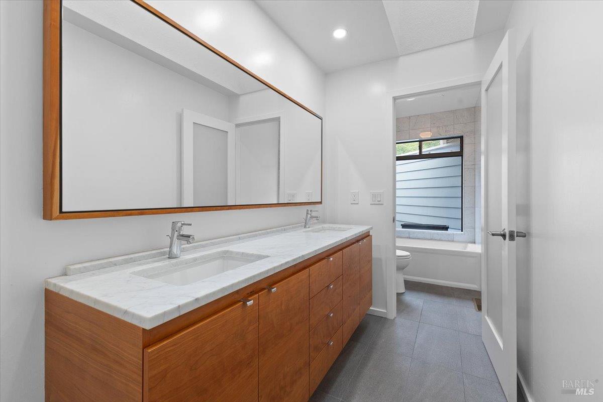 668 Wild Oak Drive Santa Rosa, CA 95409 - Photo 26 of 46 a bathroom with a sink and a mirror