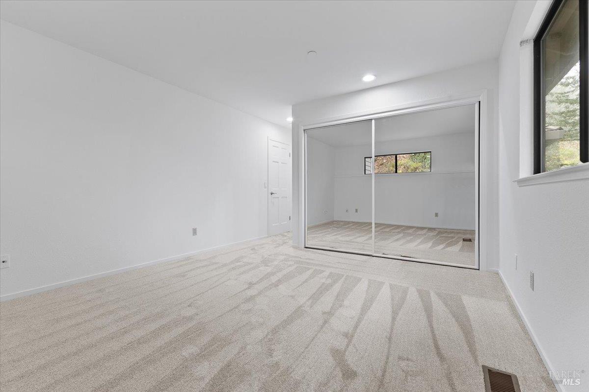 668 Wild Oak Drive Santa Rosa, CA 95409 - Photo 29 of 46 an empty room with a empty space and windows