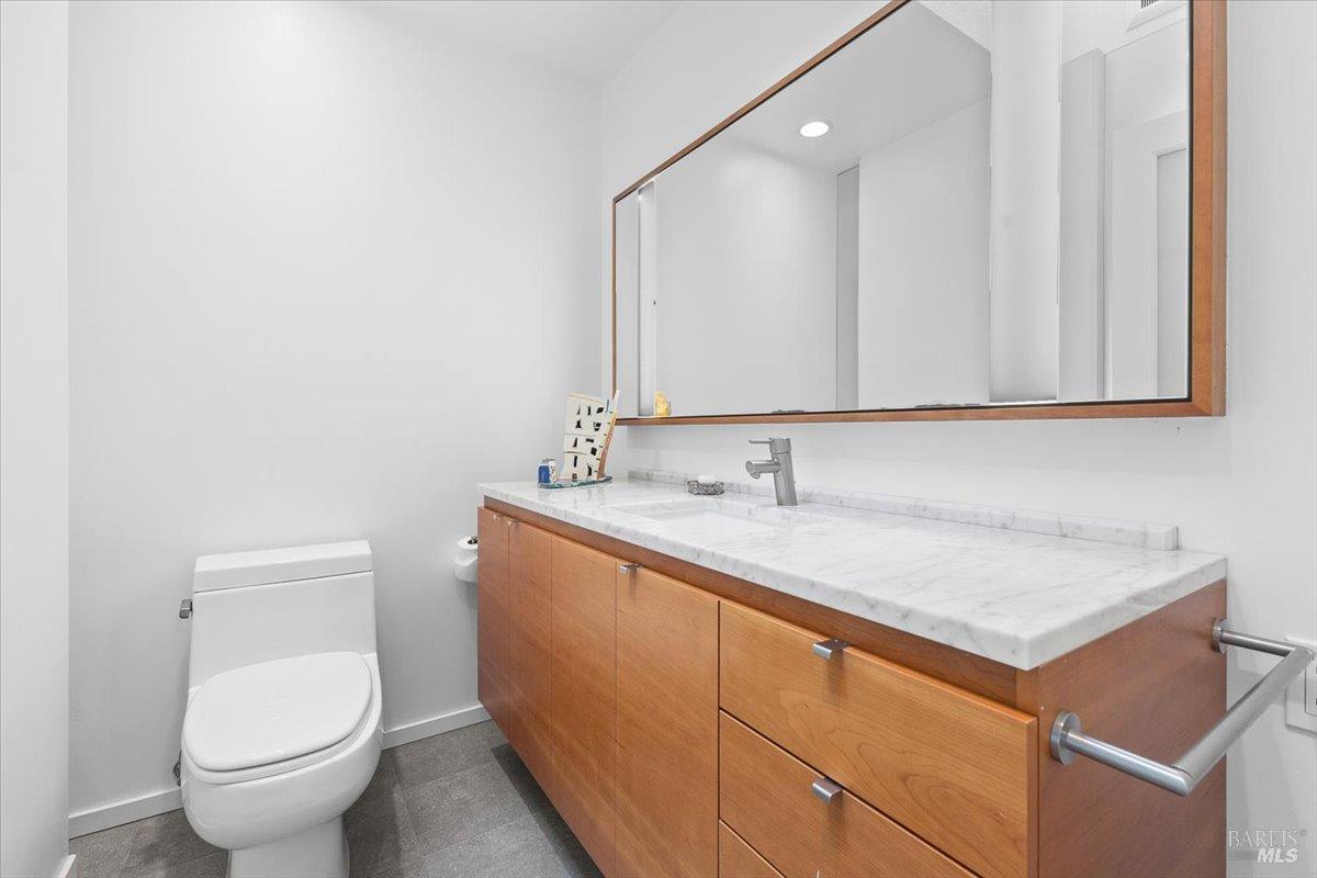 668 Wild Oak Drive Santa Rosa, CA 95409 - Photo 35 of 46 a bathroom with a toilet sink and mirror