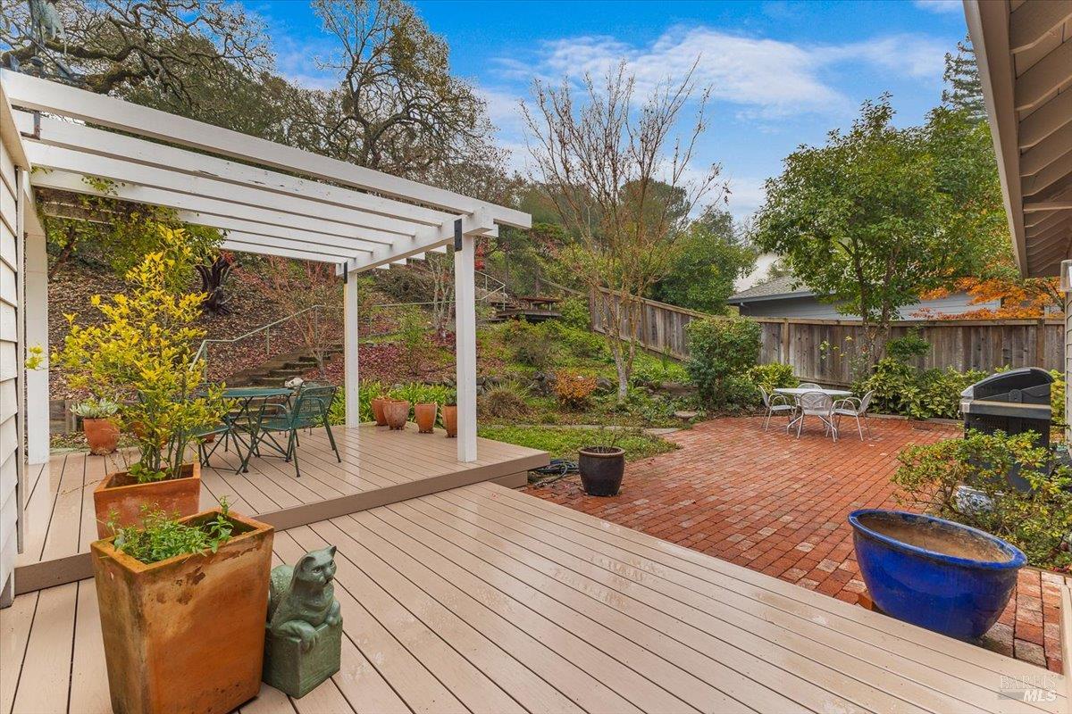 668 Wild Oak Drive Santa Rosa, CA 95409 - Photo 39 of 46 a view of a patio with couches table and chairs and potted plants