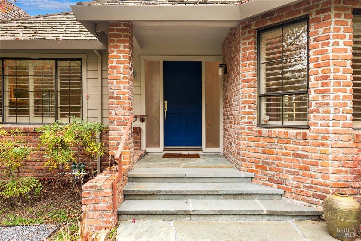 668 Wild Oak Drive Santa Rosa, CA 95409 - Photo 4 of 46 a front view of a house with a window and potted plants