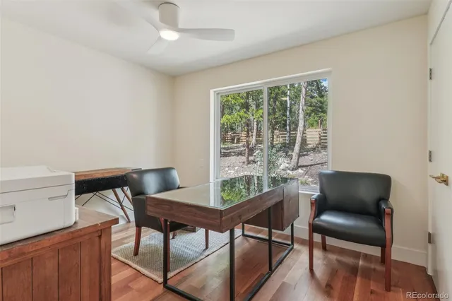 a work room with furniture and a window