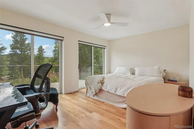 a bed sitting in a room next to a window