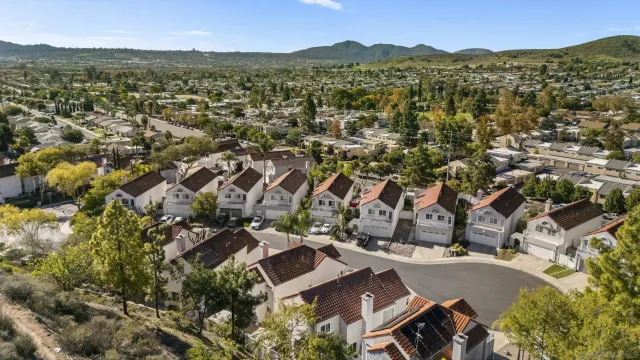 an aerial view of residential house with parking space