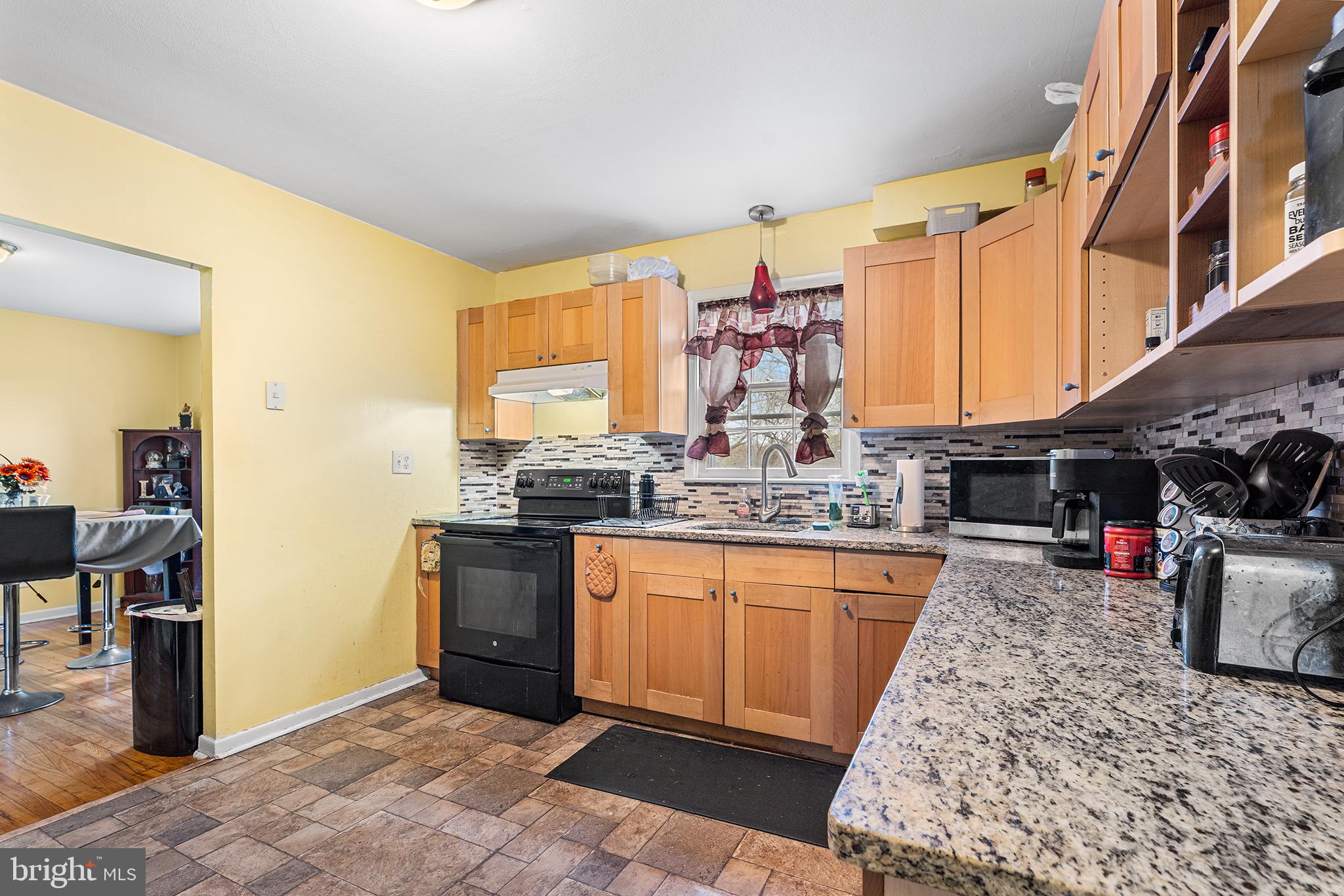 80 Nancy Lane Ewing, NJ 08638 - Photo 15 of 33 a kitchen with stainless steel appliances granite countertop a sink stove and refrigerator