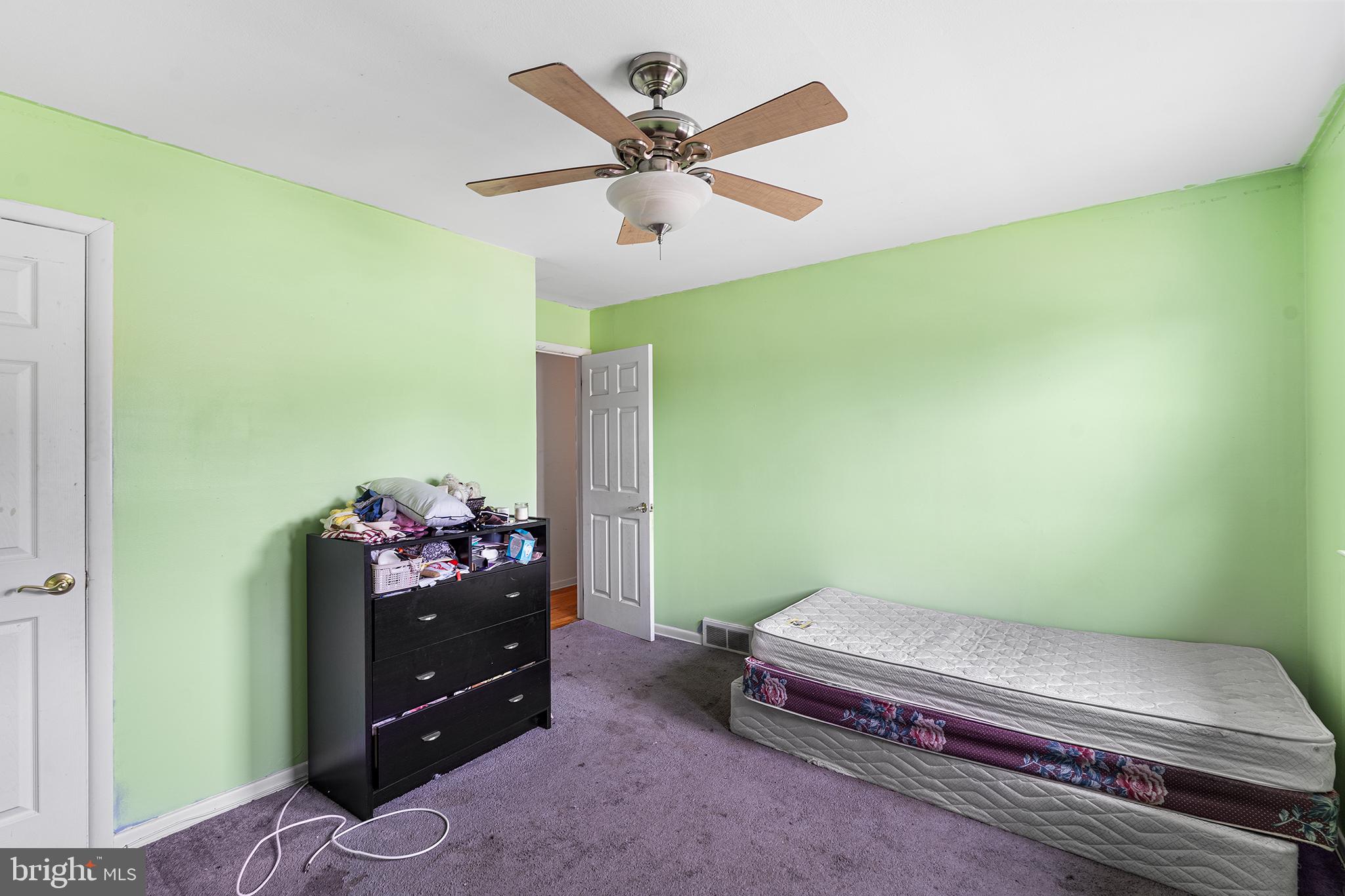 80 Nancy Lane Ewing, NJ 08638 - Photo 25 of 33 a bedroom with a bed and ceiling fan