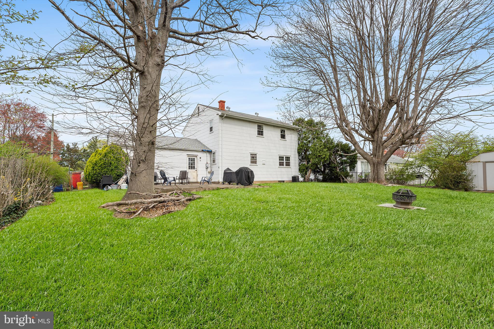 80 Nancy Lane Ewing, NJ 08638 - Photo 29 of 33 a view of a white house with a big yard and large tree