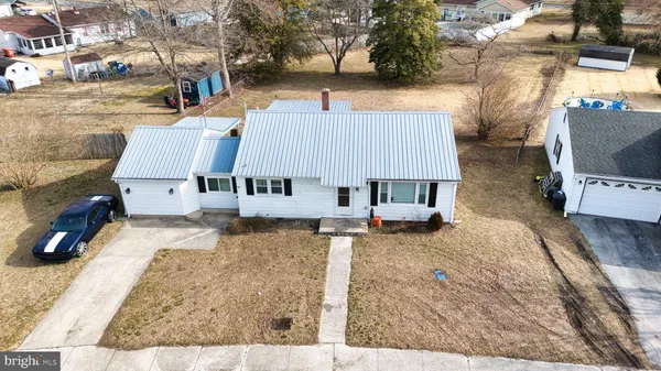 an arial view of a house with roof yard