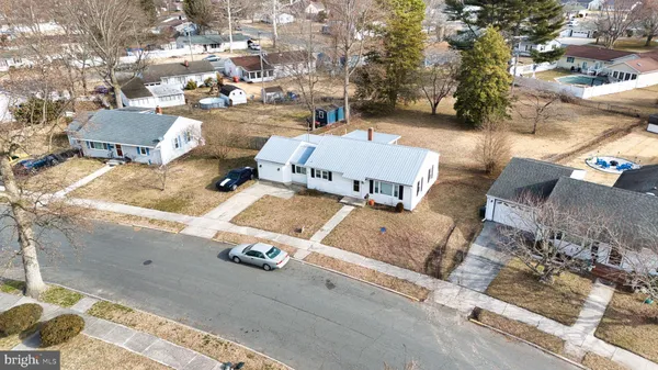 an aerial view of a house with outdoor space
