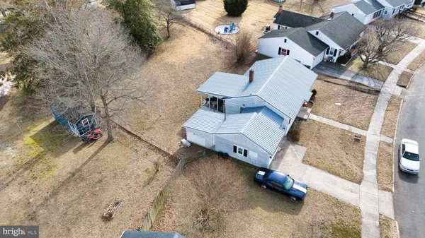 an aerial view of houses with yard