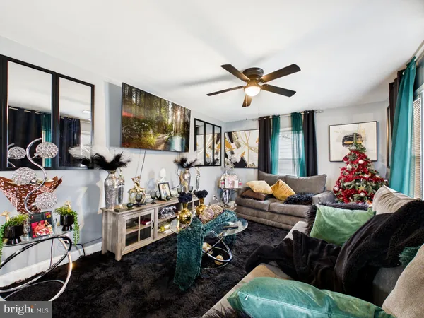 a living room with furniture fireplace and flat screen tv