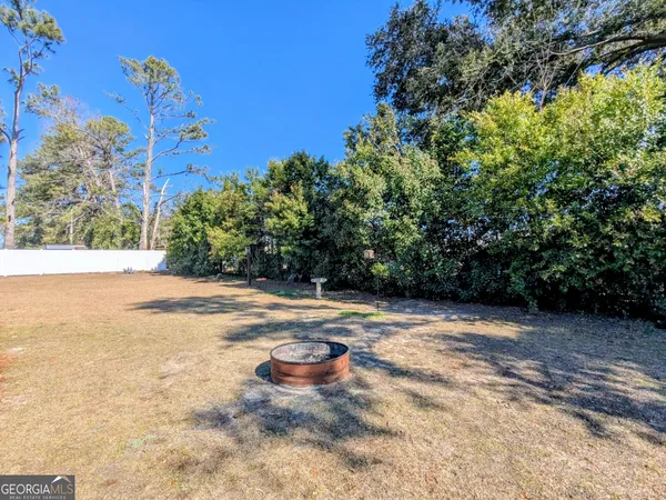 a view of a backyard of the house