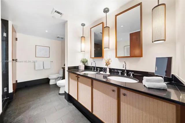 a bedroom with a bed and large window