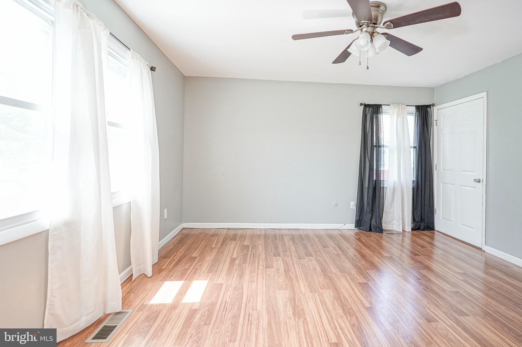32 Country Club Road Willingboro, NJ 08046 - Photo 17 of 39 a view of empty room with wooden floor and fan