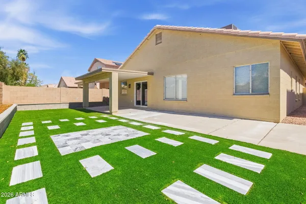 a front view of a house with a yard and porch
