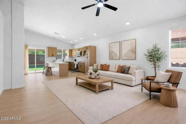 a living room with furniture and a large window