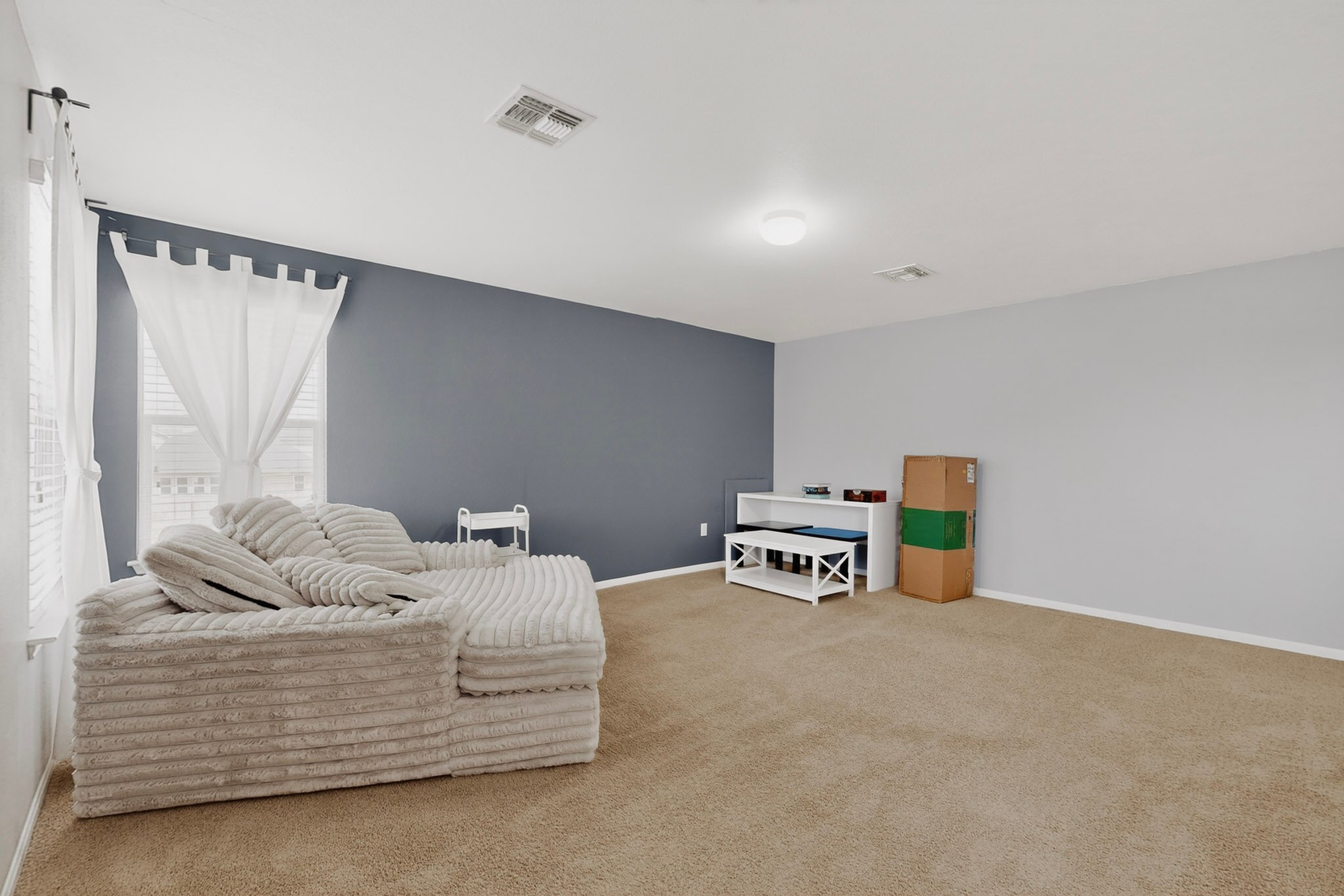 14513 Esker Road Manor, TX 78653 - Photo 15 of 38 A versatile living space with light-colored carpeting, ideal for various arrangements.
