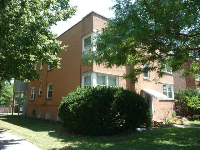 a view of a house with a garden