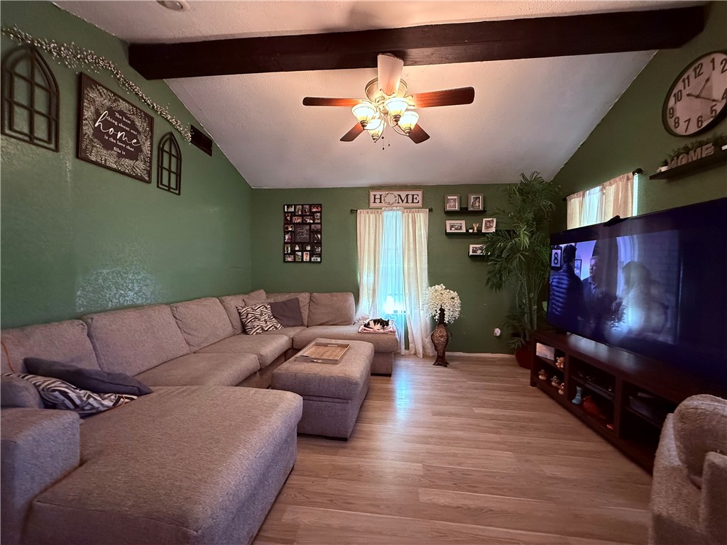 5742 Hidden Valley Loop Sandia, TX 78383 - Photo 11 of 32 a living room with furniture and a flat screen tv