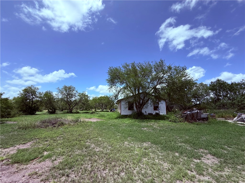 5742 Hidden Valley Loop Sandia, TX 78383 - Photo 18 of 32 a view of a field of grass and trees