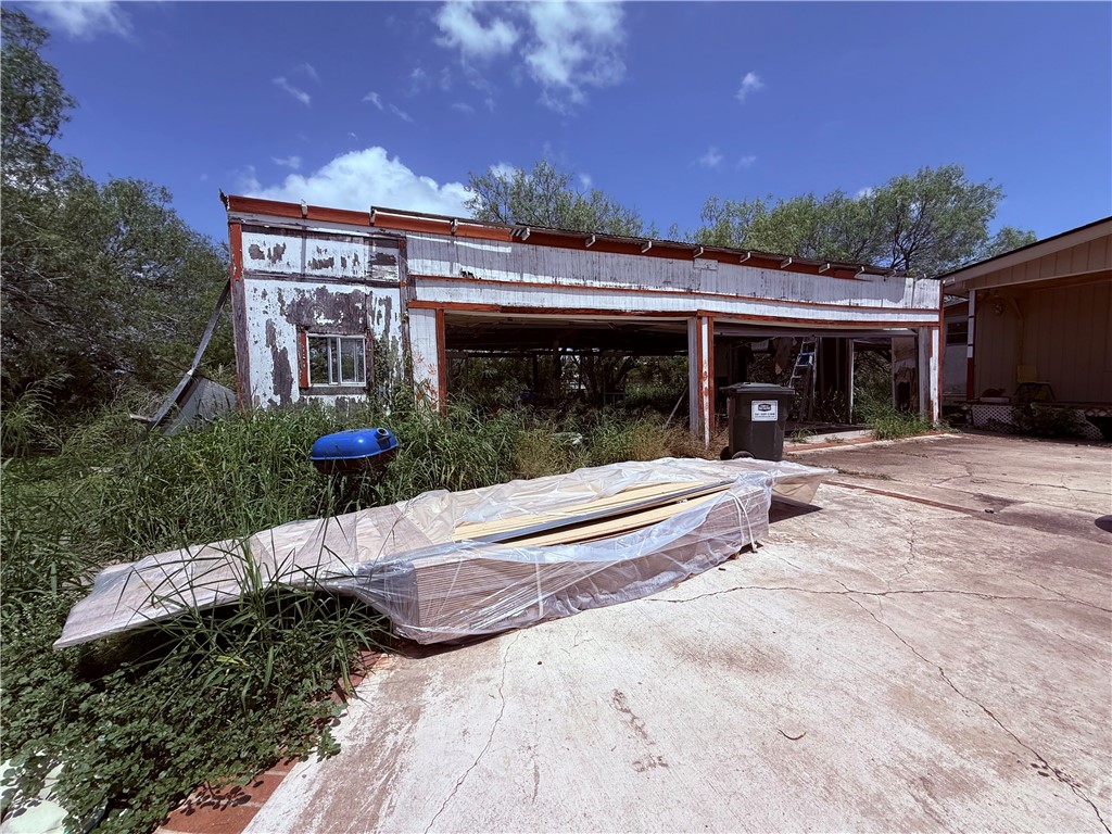 5742 Hidden Valley Loop Sandia, TX 78383 - Photo 21 of 32 a view of a house with backyard and porch