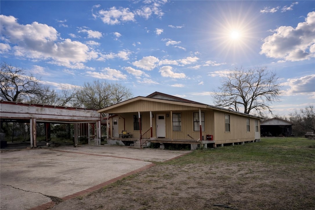 5742 Hidden Valley Loop Sandia, TX 78383 - Photo 29 of 32 a front view of house with a garden